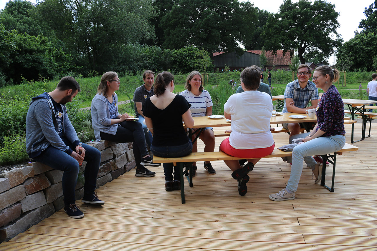 Colleagues chat on the terrace